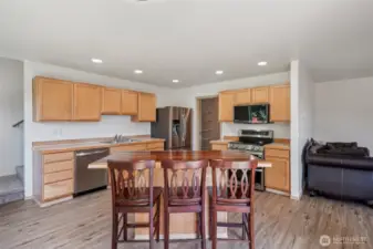 Kitchen with island.. very cool slab wood top.