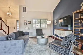 You will be greeted by light and bright Family Room featuring Vaulted Ceilings. Entering the home looking back at front door...stairs lead to upstairs (2) bedrooms and huge bonus room over the 2-car garage.