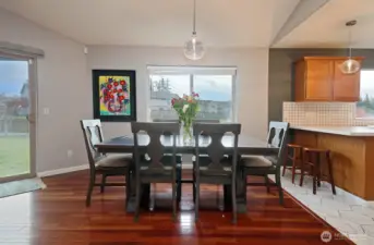 Another view of the dining area and stools under the counter for snacks and chatting with the cook!