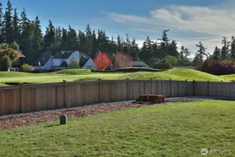 Fencing keeps pups and kids in from the golf course and golfers going by!