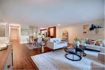 Living room view looking into hallway and kitchen