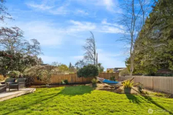 Large fenced back yard, alley access.