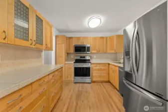 Looking to the stove from the dining area.