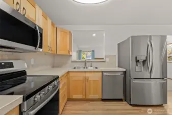 Enjoy this passthrough window to keep the kitchen and additional living space connected.