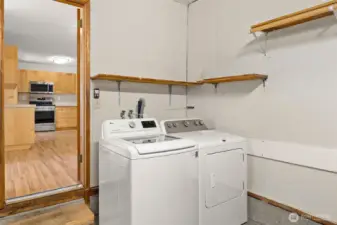 Garage access conveniently off the kitchen with laundry space.