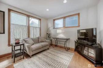 family room off kitchen allows one to work in the kitchen and still socialize with guests or watch tv