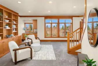 Family room on middle level boasts built ins and views