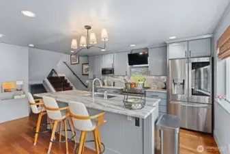 Granite surfaces abound amid high-end, stainless appliances