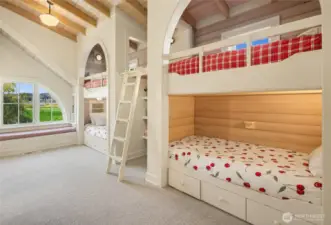 The children’s wing is a stroke of genius, featuring a boys’ bunk room and a girls’ bunk room, each with its own bathroom. The bunk room sleeps 6, not shown is sleeping chest with a fold our bed.