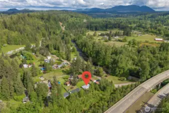 Nestled in nature, this home sits in a peaceful community with the river nearby and amenities still close at hand.
