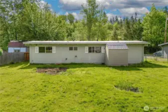 Spacious backyard with mature trees, ideal for pets, gardening, or entertaining. Plenty of room to make it your own oasis.