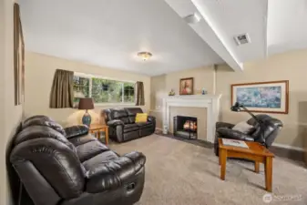 The sun-kissed lower level boasts an additional bedroom, full bath, laundry and large family room with a second fireplace and backyard access - great MIL suite potential!