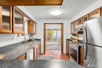Kitchen flows into double-door sunroom