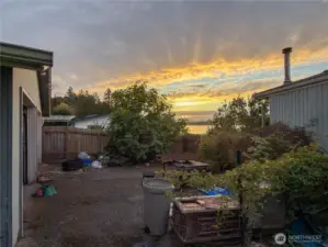 Back yard has great potential, large driveway to the oversized garage.