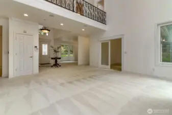 Open concept living looking toward entry