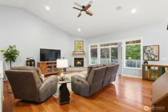 Spacious family room with seamless gleaming hardwoods.