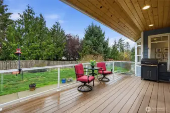 Spacious covered deck ideal for outdoor dining, relaxing, and taking in the stars.