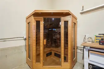 Sizable 3-car garage with relaxing sauna and abundant storage.