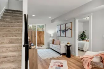 Spacious living area on the ground level. Photo of model home