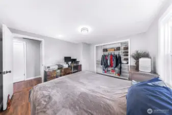 Primary bedroom complete with custom closet shelving in closet.