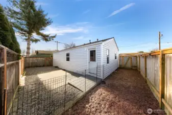 Parking area, pario and fenced dog run.