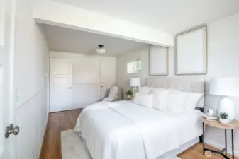 This primary bedroom has gorgeous new white oak floors.