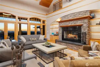 Delightful living room with gas assisted wood burning fireplace