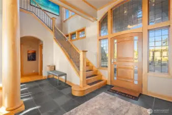 Upon entry a soaring staircase will take you upstairs and the vast view.