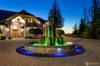 Elegant water fountain welcomes guests as they arrive, multi color lighting, Seahawks Today