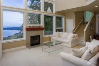 Cozy up in front of the fire place to take in those water views