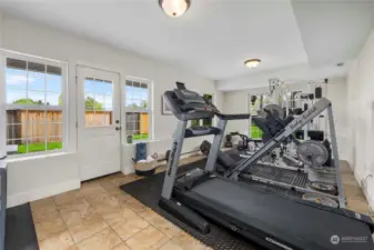 Flex room here has endless possibilities and is currently being used as a home gym.