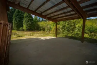 Covered shelter off barn