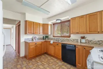 Kitchen into back entry and garage entrance. Coat closet too.