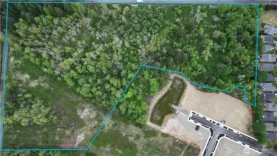 Tumwater Development Opportunity – Prime 18.89-Acre Parcel.  An exceptional opportunity awaits with this expansive parcel featuring nearly a 1/4 mile of frontage on Trosper Road.  Access and utilities are available in the street. - Boundary lines are approximated -