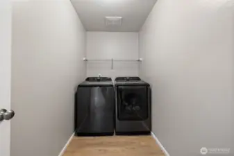 The laundry room is conveniently located near all bedrooms.