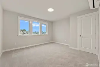 Upstairs front bedroom is large with lots of light and a view of the mountains.