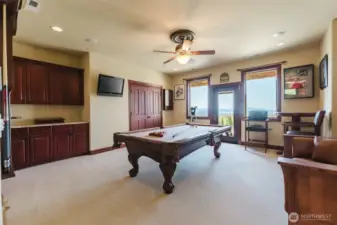 The bonus room has plenty of space for game night. There is a spacious balcony outside the door, perfect for taking in the views or watching Fireworks!