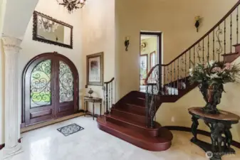 Beautiful 2" Teakwood French entry doors were imported from Indonesia. When you step inside you will notice the beautiful polished travertine tile floors.