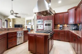 The chef's kitchen includes marble countertops, and stainless Viking & Subzero appliances. Entertaining a large group is a breeze here!