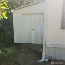 Shed at exterior far end of home
