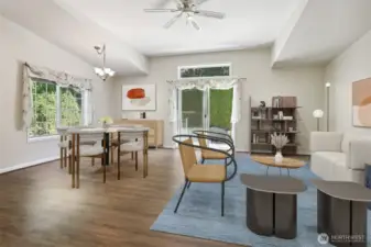Family room and eating area opens to kitchen.  Sliding door opens to back patio that borders the community greenbelt and trail.  Virtually staged photo.