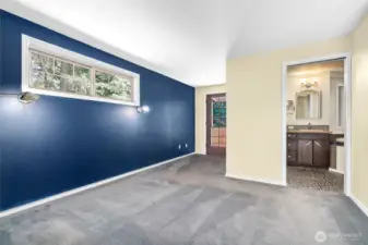 Upper primary bedroom with door to private deck.