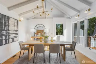 Dining room with vaulted ceilings makes it the perfect place for dinner parties.