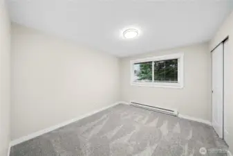 2nd bedroom sits off kitchen with brand new carpet, paint, trim, lighting and doors
