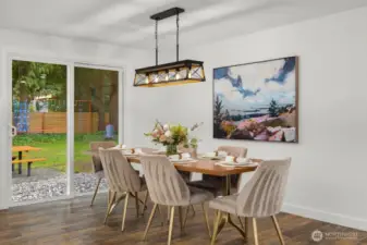 Dining leads to spacious backyard