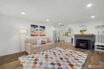 2nd living room with wood stove fireplace provide flexibility for relaxing, game room, play room, or working from home.