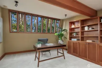 Built-in bookshelves and cabinetry in the loft