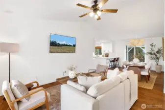 The spacious living room is ready to host it all, offering the perfect gathering space for friends and family. It flows seamlessly into the dining area off the kitchen, making everyday living and entertaining feel effortless.