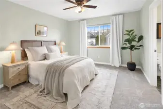 The primary bedroom is a true retreat, featuring a spacious walk-in closet and a private en-suite bath for ultimate comfort and convenience.