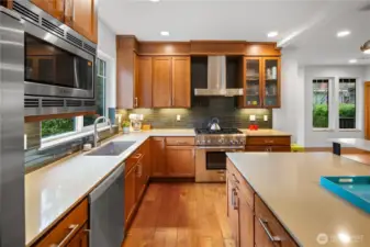 A full suite of stainless appliances, quartz counters, and generous prep space make this kitchen as practical as it is polished.